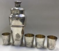 OF GOLFING INTEREST: A rare silver plated cocktail shaker with stacking beakers.
