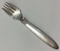 GEORG JENSEN: A small silver dessert fork of typical form.