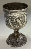 A 19th Century German silver beaker with chased decoration.