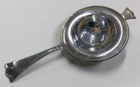 A large pierced Continental silver tea strainer.