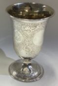 A large Victorian silver kiddush cup with engraved decoration.