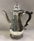 A large fine quality baluster shaped Georgian silver coffee pot.