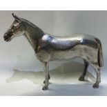 A good cast silver figure of a racehorse with textured body.