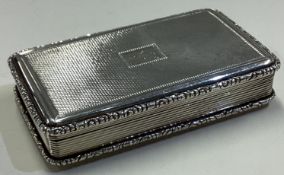 A large William IV silver engine turned snuff box.