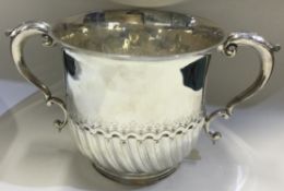 A fine Victorian silver porringer in the early Queen Anne style.