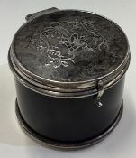 A silver and tortoiseshell jewellery box with hinged lid.