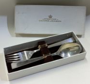 GEORG JENSEN: A silver spoon and fork with block pattern in original box.