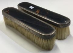 A pair of silver and faux tortoiseshell brushes. London 1921.