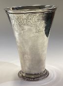 A fine quality tapering silver vase with gilded decoration to spreading foot.
