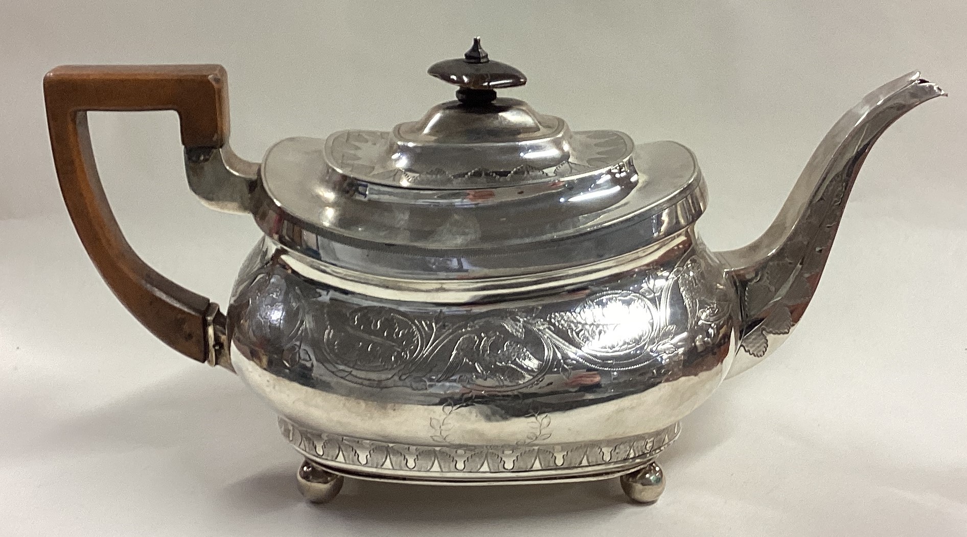 A George III silver teapot engraved with eagles and leaf decoration. - Image 4 of 5