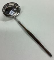 A Georgian silver toddy ladle.