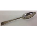 A Chinese trade silver spoon with bright-cut decoration.