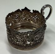 A pierced silver tea glass holder. Sheffield 1902.