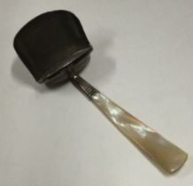 A Georgian silver and MOP caddy scoop. London.
