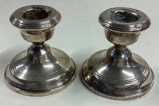 A pair of silver piano candlesticks.
