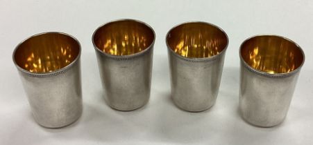 A set of four Russian silver stacking shot cups.