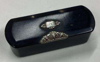 A silver mounted pill box with hinged lid. London 1915.