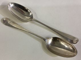 A pair of 18th Century Georgian silver bottom marked dessert spoons.