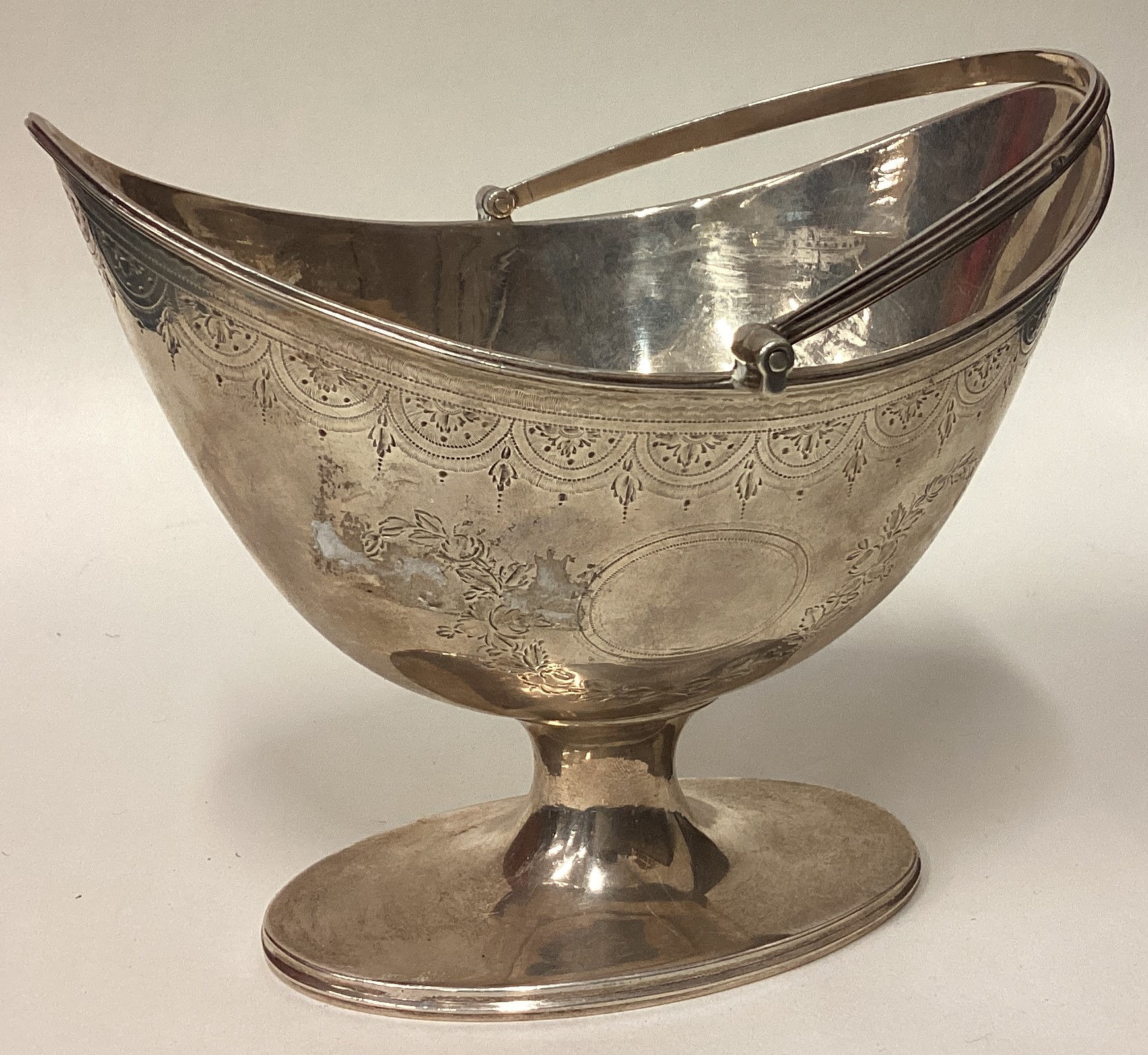 An 18th Century George III silver basket with bright-cut decoration. - Image 2 of 3