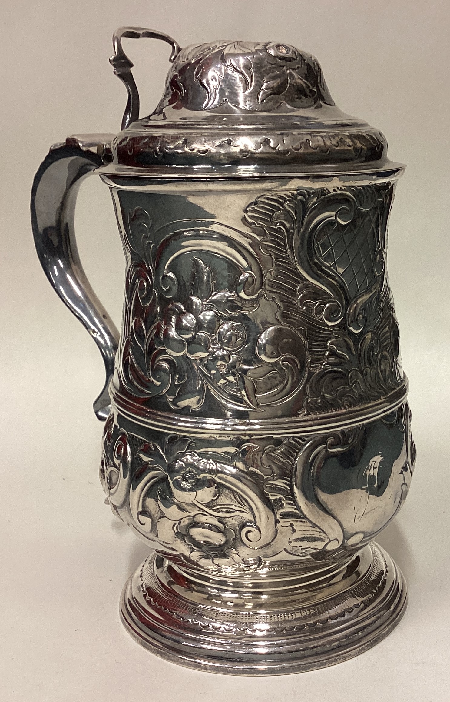 An 18th Century chased silver tankard. London 1772.