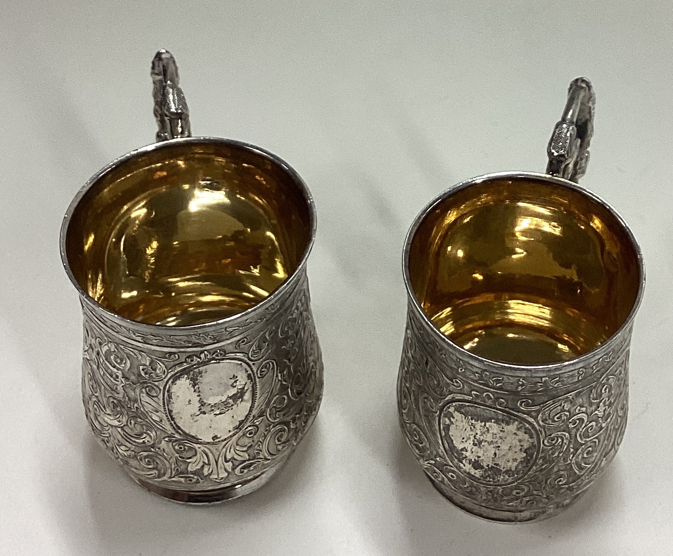 A pair of chased French silver shot cups with handles. - Image 2 of 4