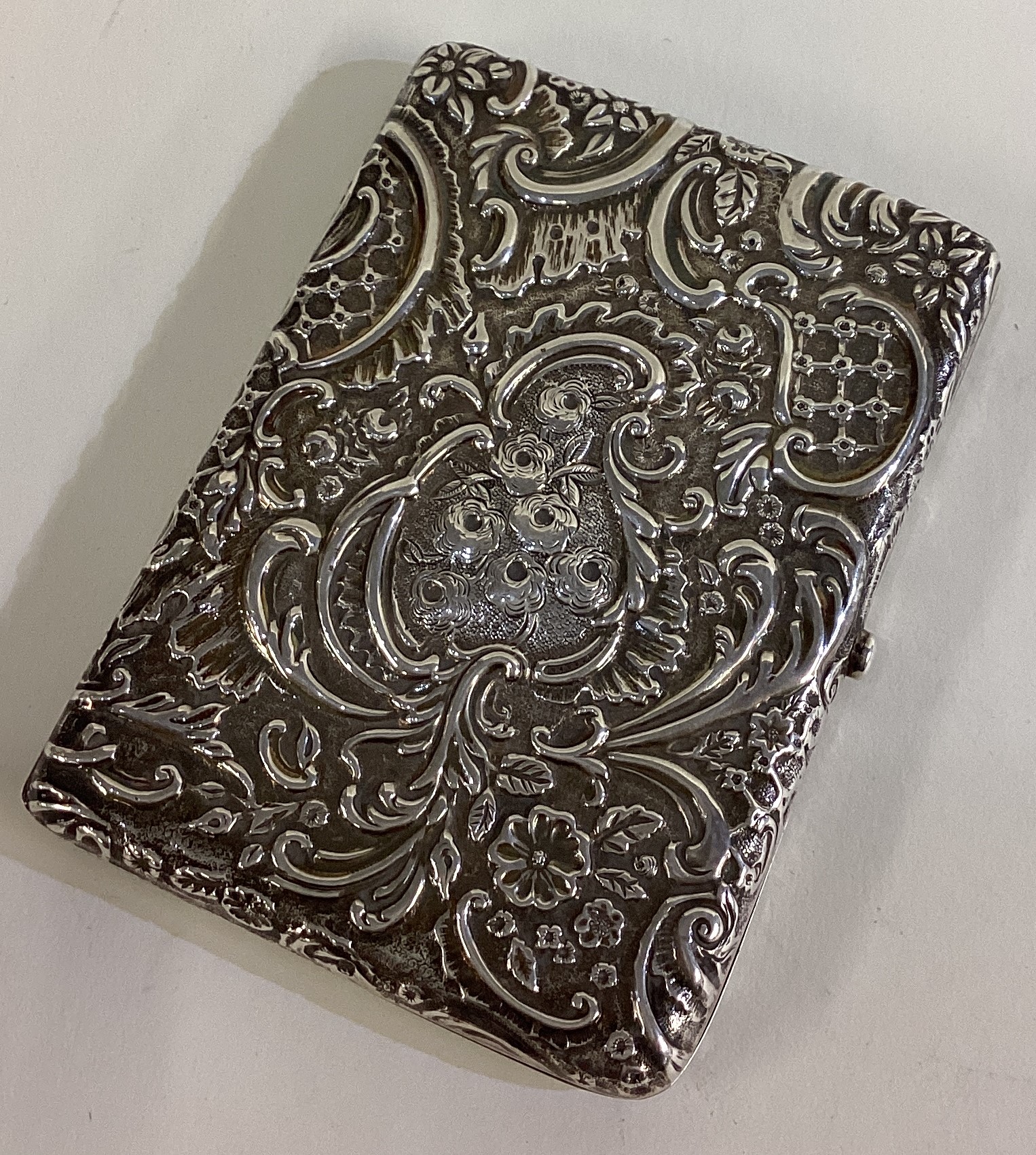 A chased Victorian silver card case. - Image 2 of 3