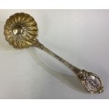 A fine silver plated gilt ladle.