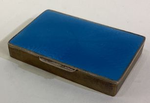 A silver plated and blue enamelled snuff box.
