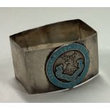 A silver and blue enamelled napkin ring.