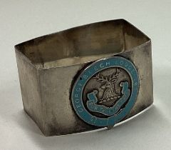A silver and blue enamelled napkin ring.