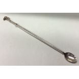 PATRICK MAVROS: A large silver cocktail stirrer.