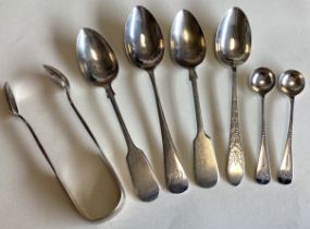 EXETER: A large collection of silver fiddle pattern teaspoons and tongs.