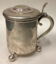 A rare silver lidded tankard. By David Andersen.