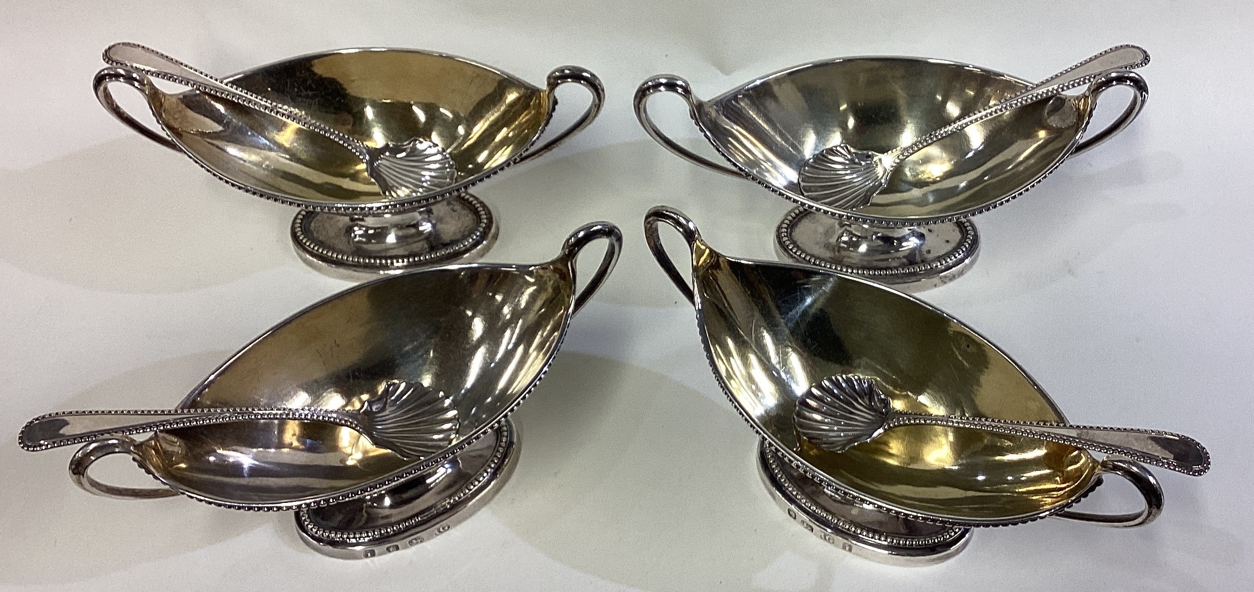 A find set of four George III silver twin-handled salts with spoons. - Image 2 of 3