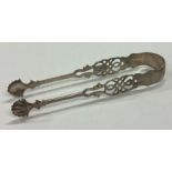 A pair of 18th Century Georgian silver ice tongs with pierced decoration.