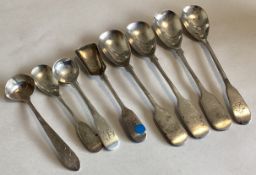 DUBLIN: A large collection of silver bright-cut and fiddle pattern salt spoons.