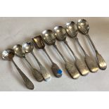 DUBLIN: A large collection of silver bright-cut and fiddle pattern salt spoons.