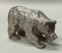 A novelty heavy silver figure of a bear.