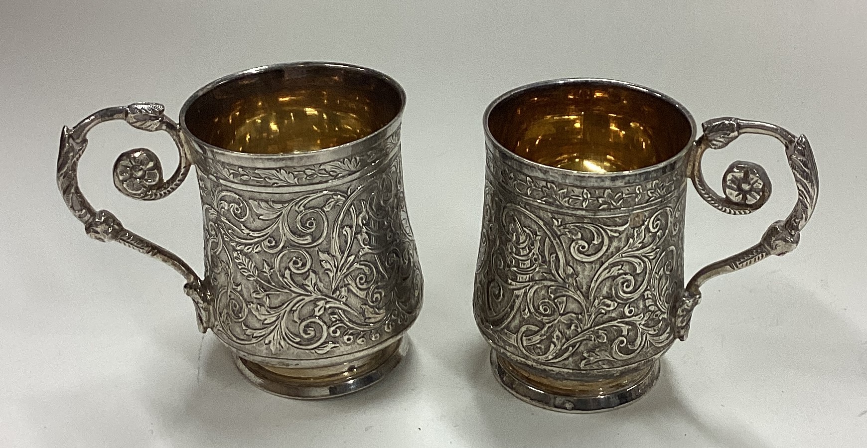 A pair of chased French silver shot cups with handles. - Image 3 of 4