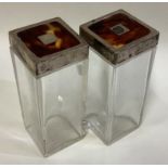 A pair of silver, glass and tortoiseshell jars.