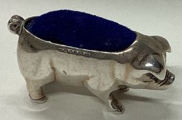 A novelty silver pin cushion in the form of a pig.
