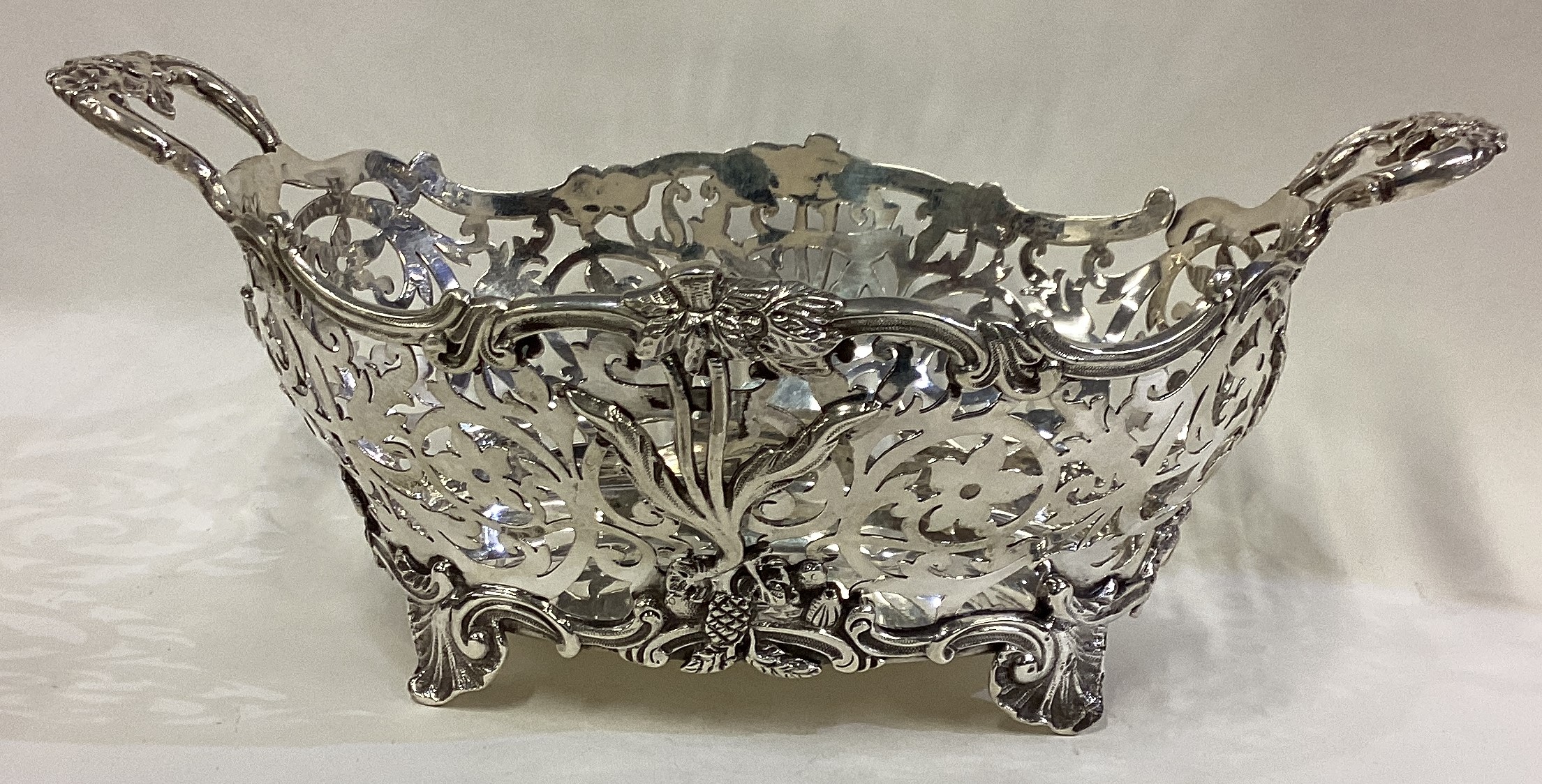 A fine Victorian silver basket with pierced decoration.