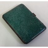 An Art Deco silver and shagreen cigarette case.