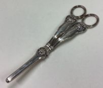 A pair of William IV silver grape scissors.