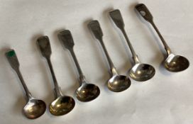 A collection of six silver fiddle pattern salt spoons.