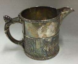 A heavy Sterling silver milk jug with chased decoration.
