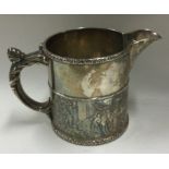 A heavy Sterling silver milk jug with chased decoration.