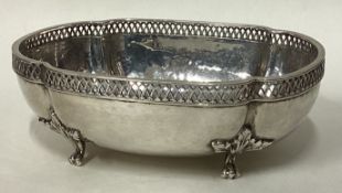 A hammered silver bowl on four feet. Birmingham 1916.