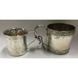 A heavy Georgian silver christening mug together with one other.