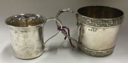 A heavy Georgian silver christening mug together with one other.